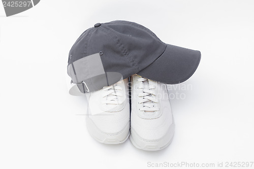 Image of Running shoes and baseball cap