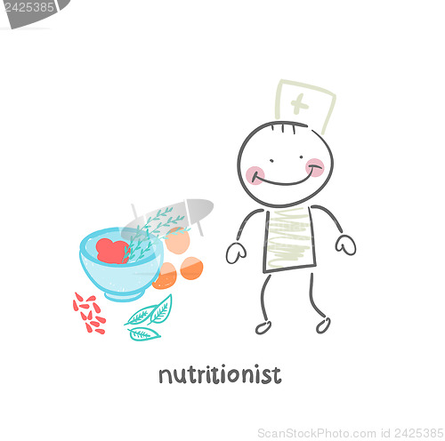 Image of nutritionist standing next to a bowl of vegetables