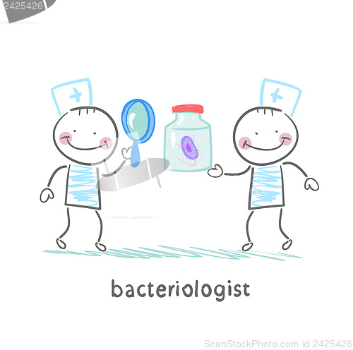 Image of bacteriologist looking through a magnifying glass on the bacteri