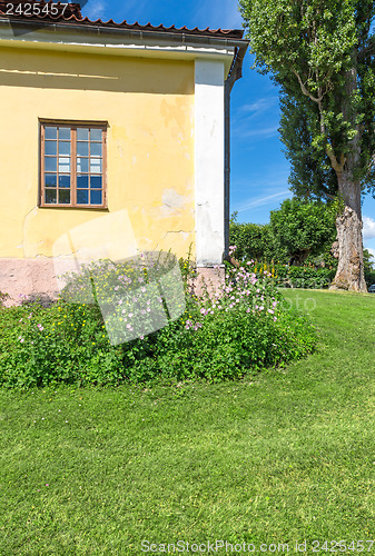 Image of Classic Scandinavian house on a green lawn