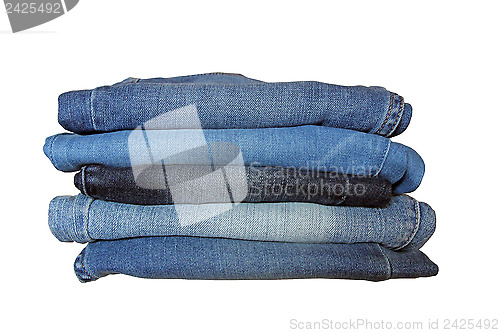 Image of Stack of Blue Jeans over White