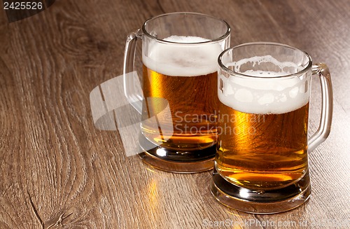 Image of Two glass beer on wooden table