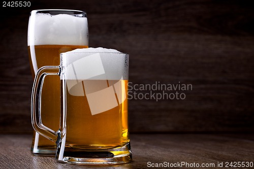 Image of Two glass beer on wooden table