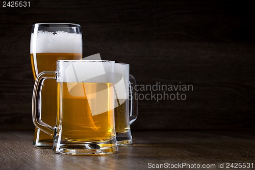 Image of Two glass beer on wooden table