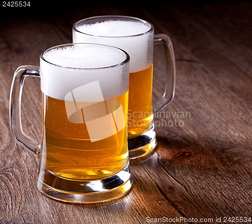 Image of Two glass beer on wooden table