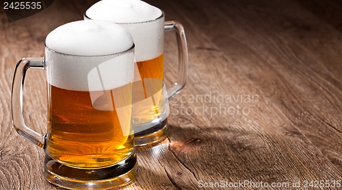 Image of Two glass beer on wooden table