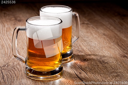 Image of Two glass beer on wooden table