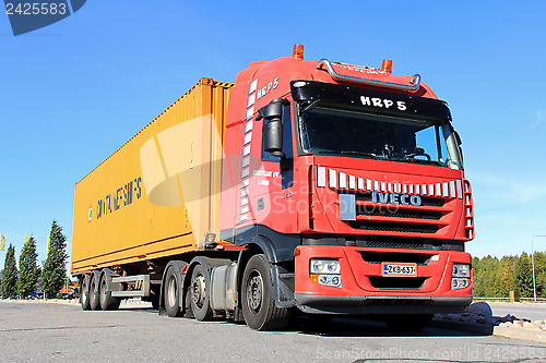 Image of Red Iveco Truck and Trailer