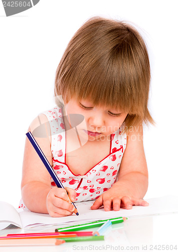 Image of Little baby girl draws pencil