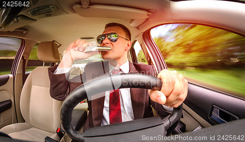 Image of Drunk man driving a car vehicle.
