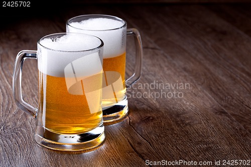 Image of Two glass beer on wooden table