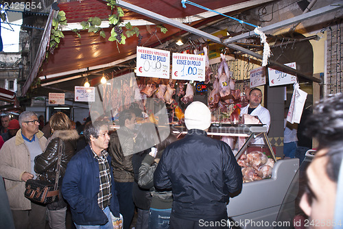 Image of butcher sells meat on the local market in Palermo