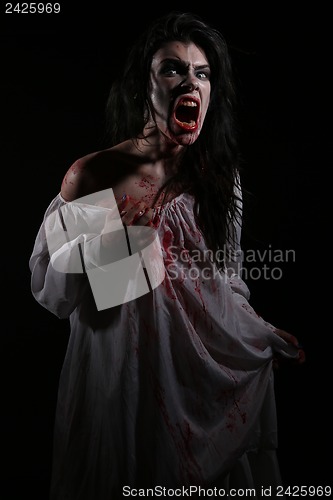 Image of Psychotic Bleeding Woman in a Horror Themed Image