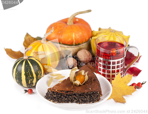 Image of poppy pie, autumn leaves and pumpkins