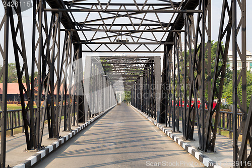 Image of Road through metal bridge tunnel