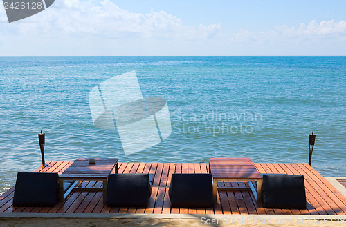 Image of sun beds for sun on the wooden floor