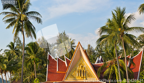 Image of Thai house with palm trees