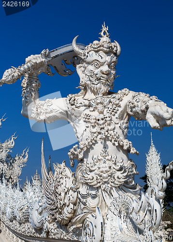 Image of sculpture soldier guards the entrance to the White temple