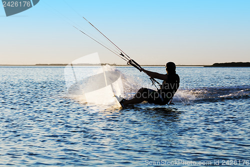 Image of Silhouette of a kitesurfer