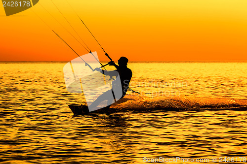 Image of Silhouette of a kitesurfer