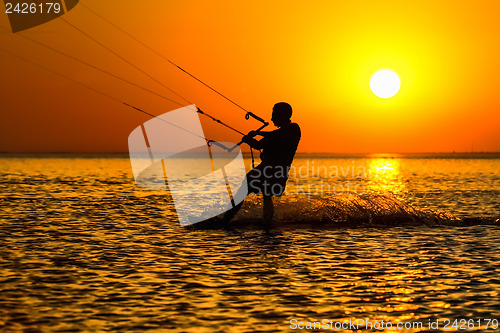 Image of Silhouette of a kitesurfer