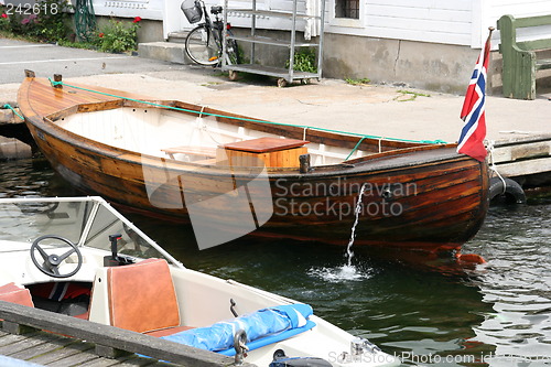 Image of Small boat with flag