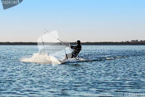 Image of Silhouette of a kitesurfer