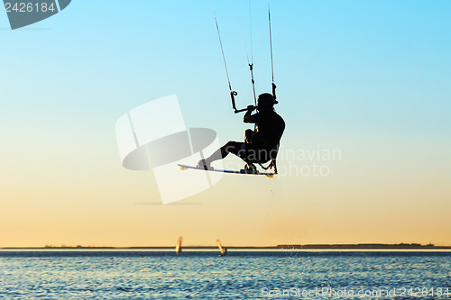 Image of Silhouette of a kitesurfer