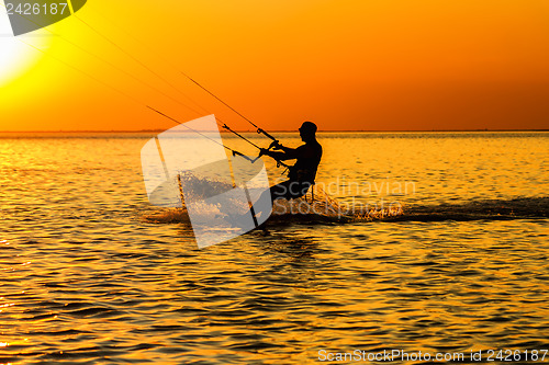 Image of Silhouette of a kitesurfer