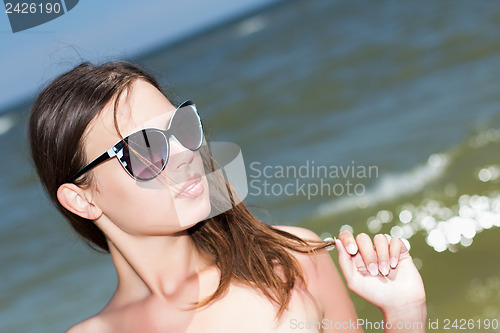 Image of Pretty woman in sunglasses