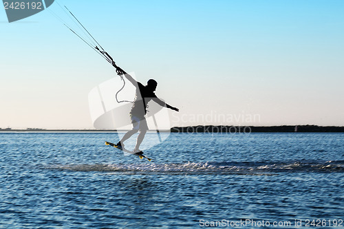 Image of Silhouette of a kitesurfer