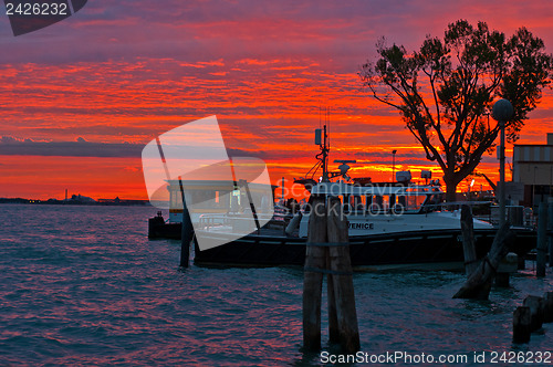 Image of Venice Italy sunset with cruise boat