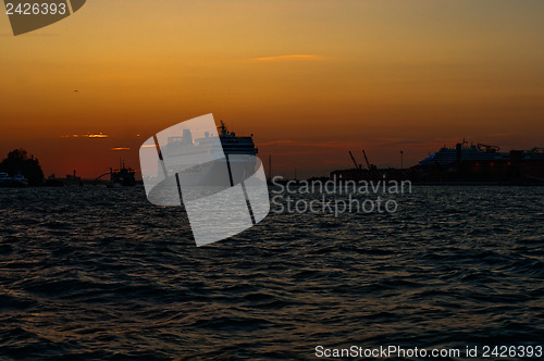 Image of Venice Italy sunset with cruise boat