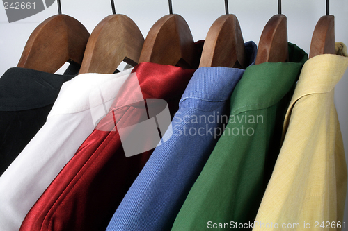 Image of Man's clothing, choice of colorful shirts