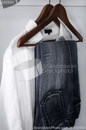 Image of Man's clothing: blue jeans and white shirt