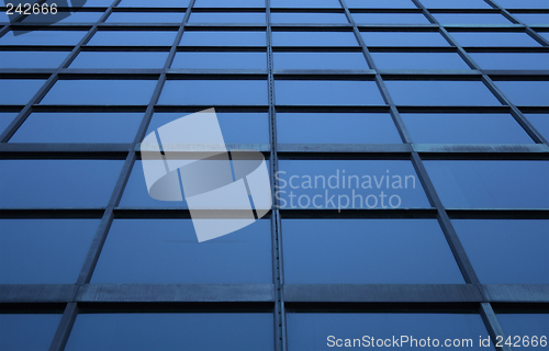 Image of Blue glass panels of a skyscraper