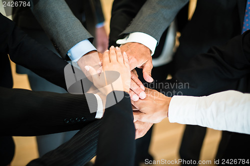 Image of Teamwork - stack of hands