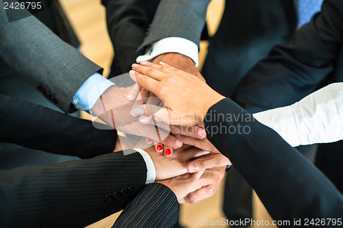 Image of Teamwork - stack of hands