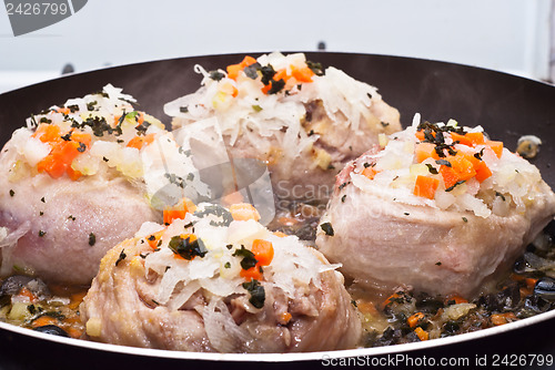 Image of veal shank cooking in pan