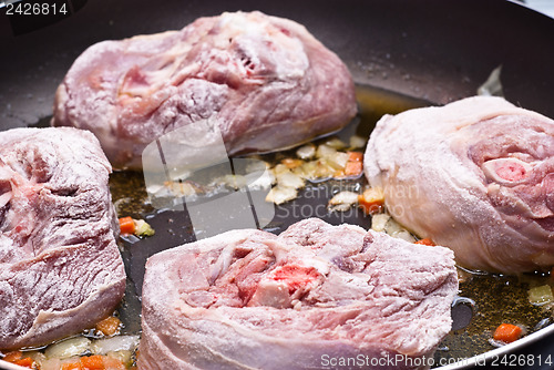 Image of floured osso buco in pan