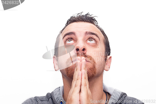 Image of man praying and looking up