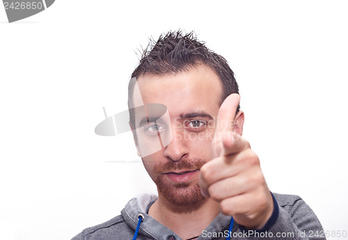 Image of Young man pointing with fingers