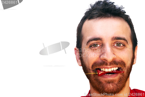 Image of man with a red hot chili pepper in his mouth