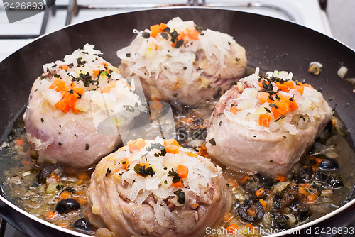 Image of veal shank cooking in pan