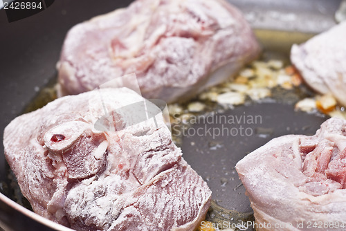 Image of floured osso buco in pan