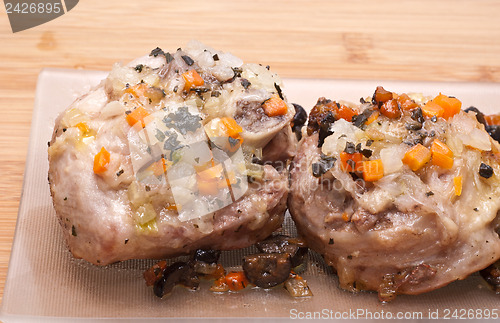 Image of ossobuco on wooden board