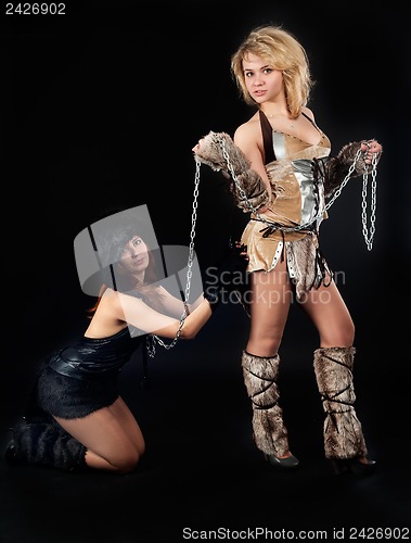 Image of Two girls in barbarian and cat costumes