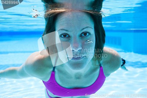 Image of Woman underwater in pool