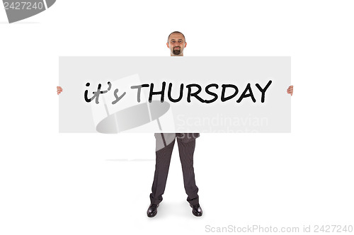 Image of Smiling businessman holding a really big blank card