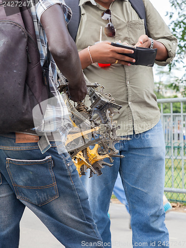 Image of PARIS - JULY 27: Eiffel tower statuettes for sale as seen on Jul